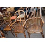 Two oak converted Windsor style commode chairs and a further Windsor style stick back armchair (3)