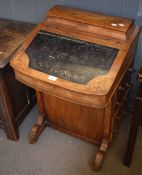 Victorian walnut davenport, the back fitted with a slightly raised stationery cabinet over a typical