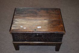 Oak bible box (probably constructed from a coffer), two planked top over a carved front and raised