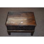 Oak bible box (probably constructed from a coffer), two planked top over a carved front and raised