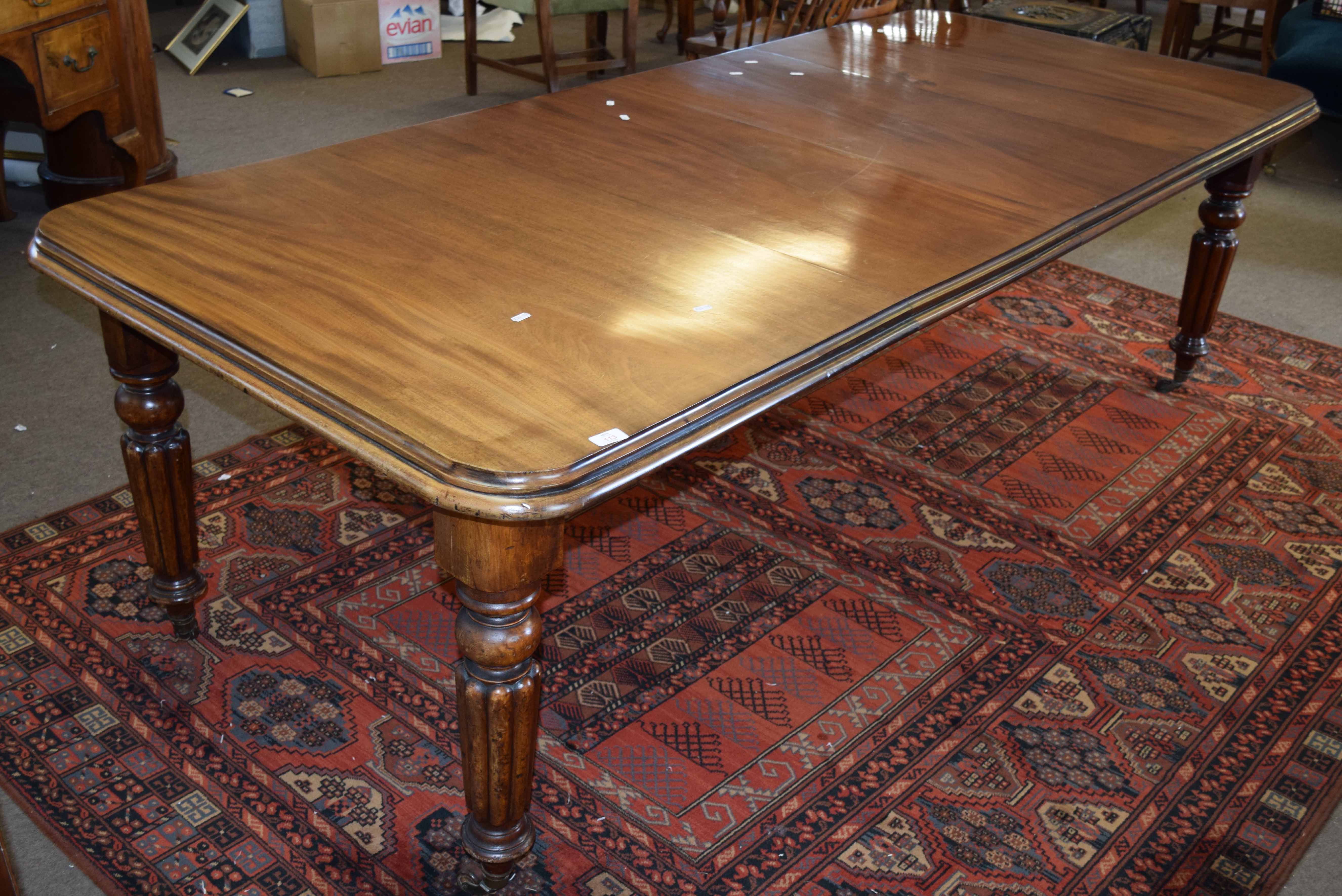 19th century mahogany wind out extending dining table with moulded edge raised on baluster and