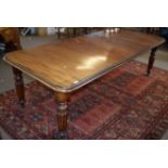 19th century mahogany wind out extending dining table with moulded edge raised on baluster and