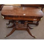 Regency period mahogany fold top card table applied throughout with brass mounts and ring handles