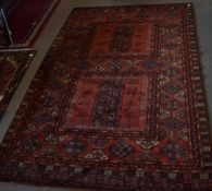 Large Caucasian style carpet multi gull border central panel of geometric designs mainly red field 2