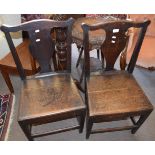 Pair of 18th century oak solid seat dining chairs, the plain supports joined all round by stretchers