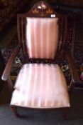 Edwardian mahogany carver chair the arch cresting rail inlaid with floral design over a pink striped