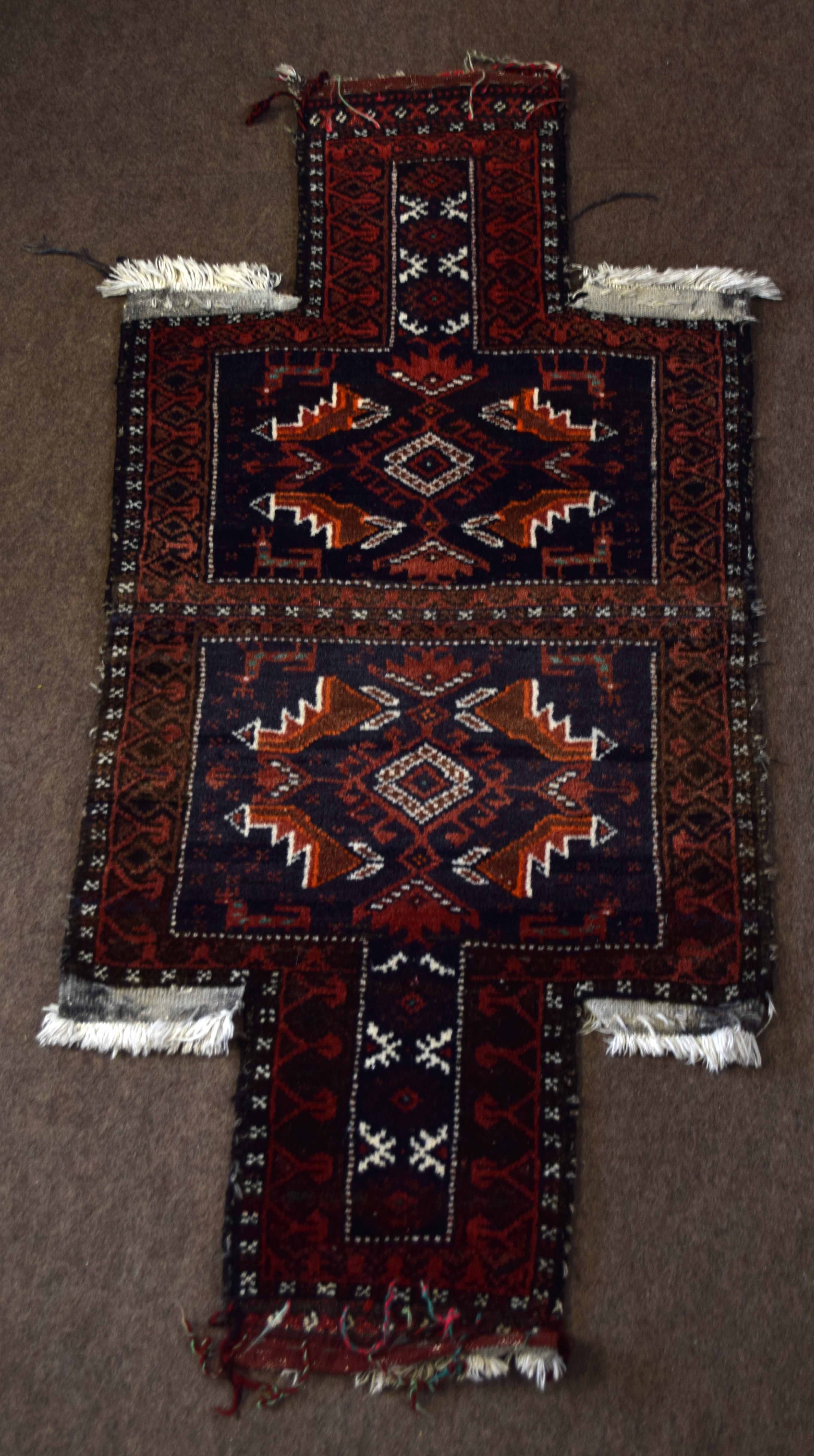 Unusual cruciform shaped prayer rug with central geometric panels mainly blue and red field 114 x