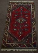 Caucasian small rug circa late 20th century central geometric pattern mainly red and green/brown