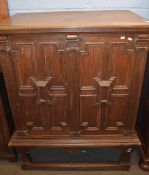 17th century and later oak cabinet on stand, two panelled front doors enclosing four drawers