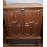 17th century and later oak cabinet on stand, two panelled front doors enclosing four drawers