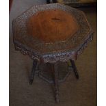 Unusual Anglo Indian style octagonal carved two tier occasional table with spreading support 49cm