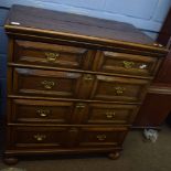 Jacobian oak chest, two short and three full width geometrically moulded drawers raised on heavy bun