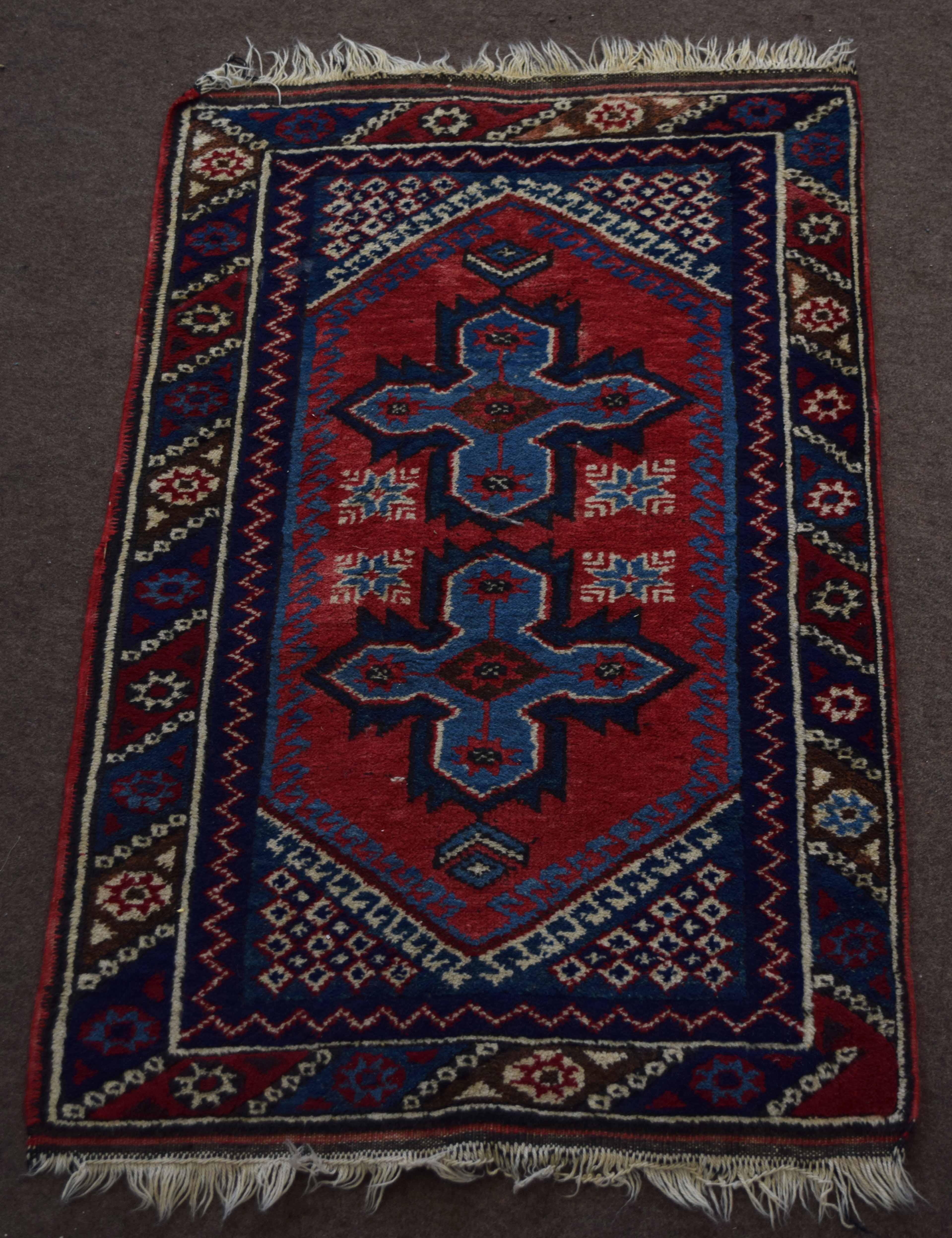 Small late 20th century Caucasian rug central cruciform design mainly red and blue field 117 x 75cm