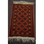 Small modern late 20th century Caucasian rug Bokhara design, rust field, 104 x 57cm