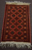 Small modern late 20th century Caucasian rug Bokhara design, rust field, 104 x 57cm