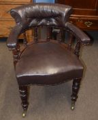 Late 19th century mahogany framed desk tub chair, upholstered in brown leather button back raised on