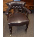 Late 19th century mahogany framed desk tub chair, upholstered in brown leather button back raised on