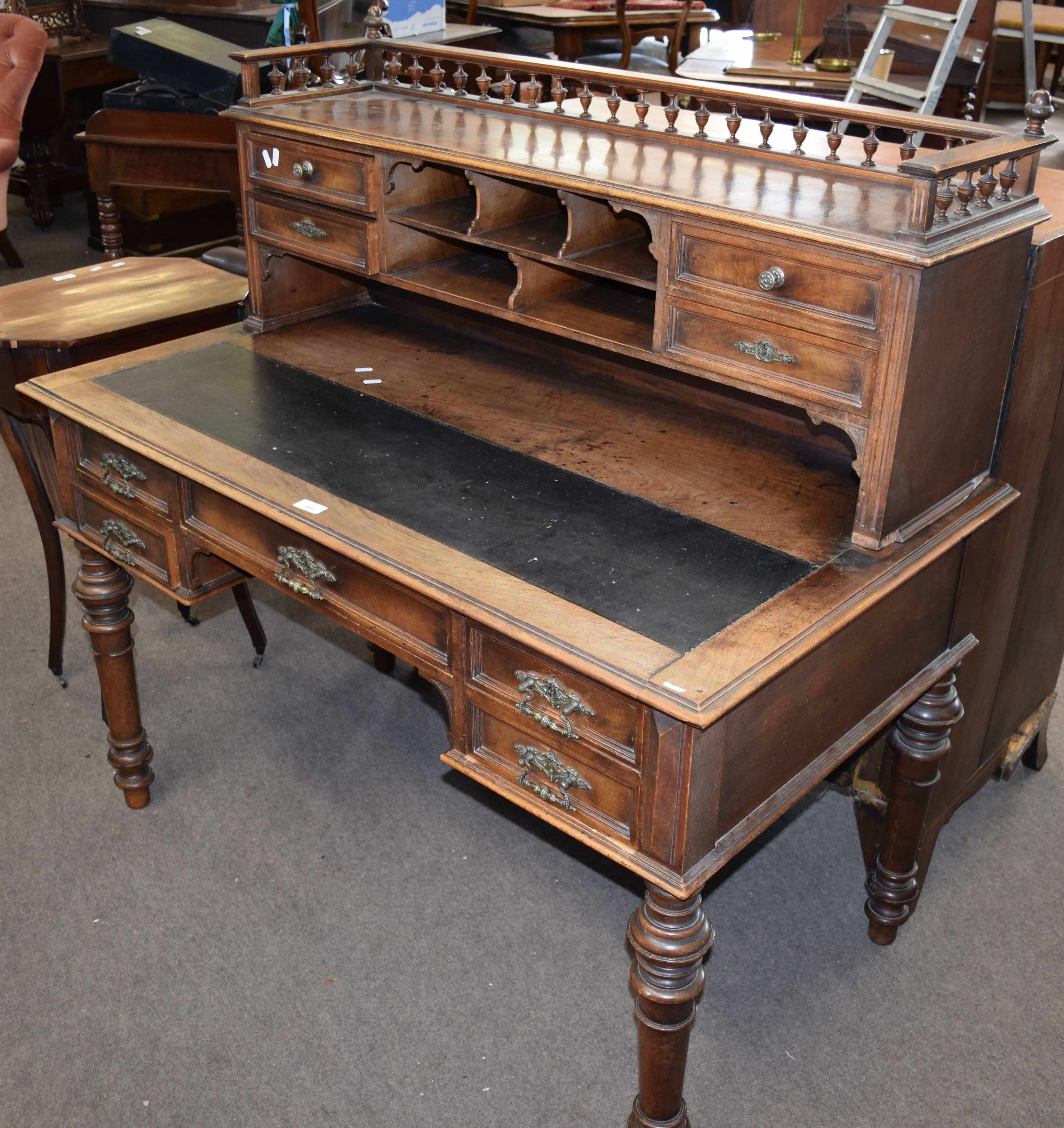 19th century mahogany desk with gallery top over pigeon holes and drawers and sliding writing
