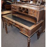 19th century mahogany desk with gallery top over pigeon holes and drawers and sliding writing