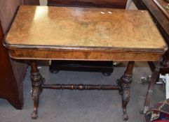 Victorian walnut card table with folding and swivelling top inlaid in the aesthetic manner raised on