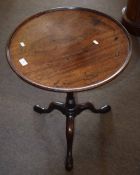 Early 19th century mahogany pedestal table, circular form with ring turned support terminating in