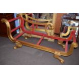 Reproduction gilded and painted chaise longue, the back rest and arm with carved birds head detail