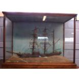 19th century model of a three-masted clipper or sloop in light oak frame, 77cm long