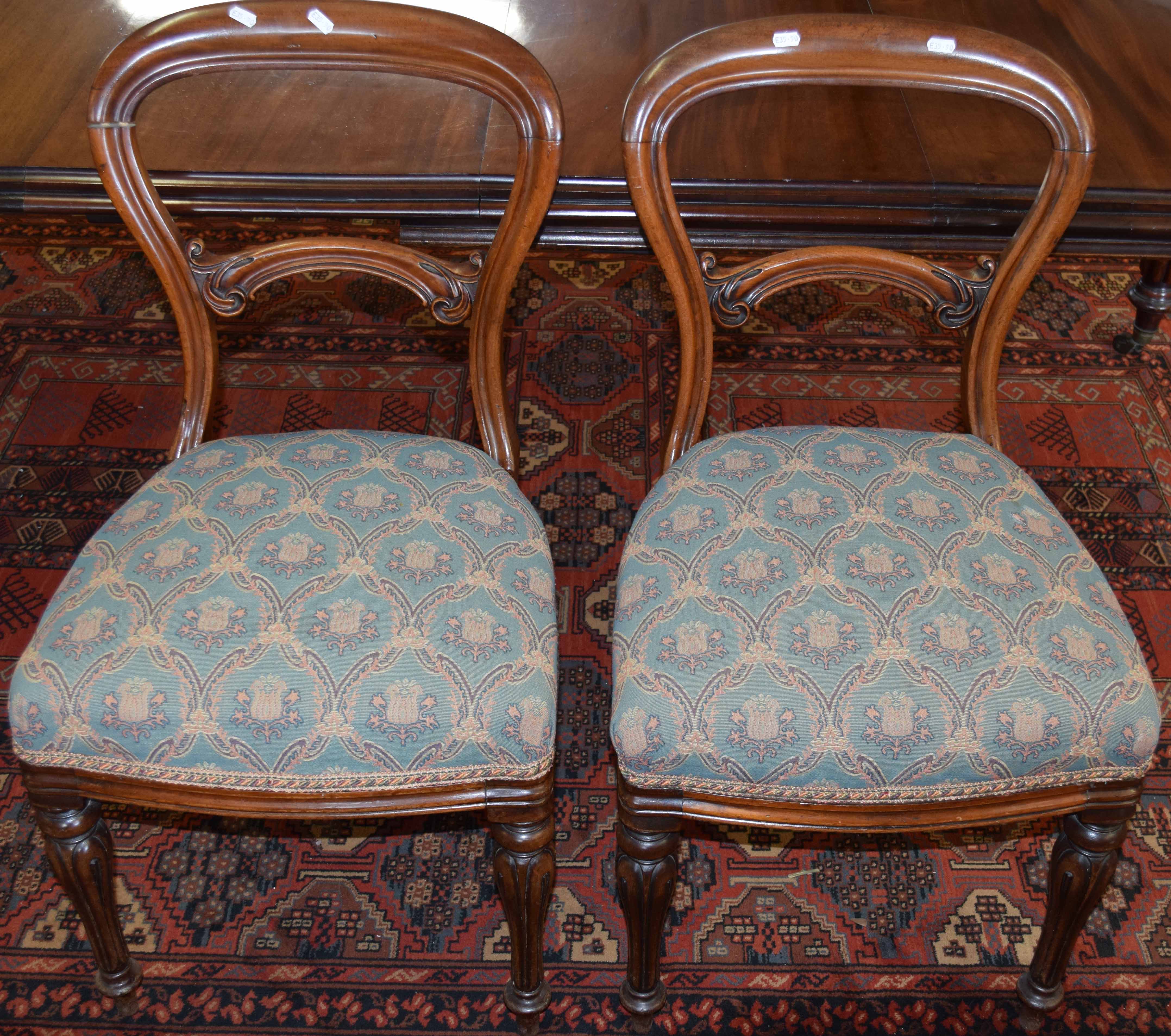 Set of six Victorian mahogany balloon back dining chairs with patterned blue upholstered seats