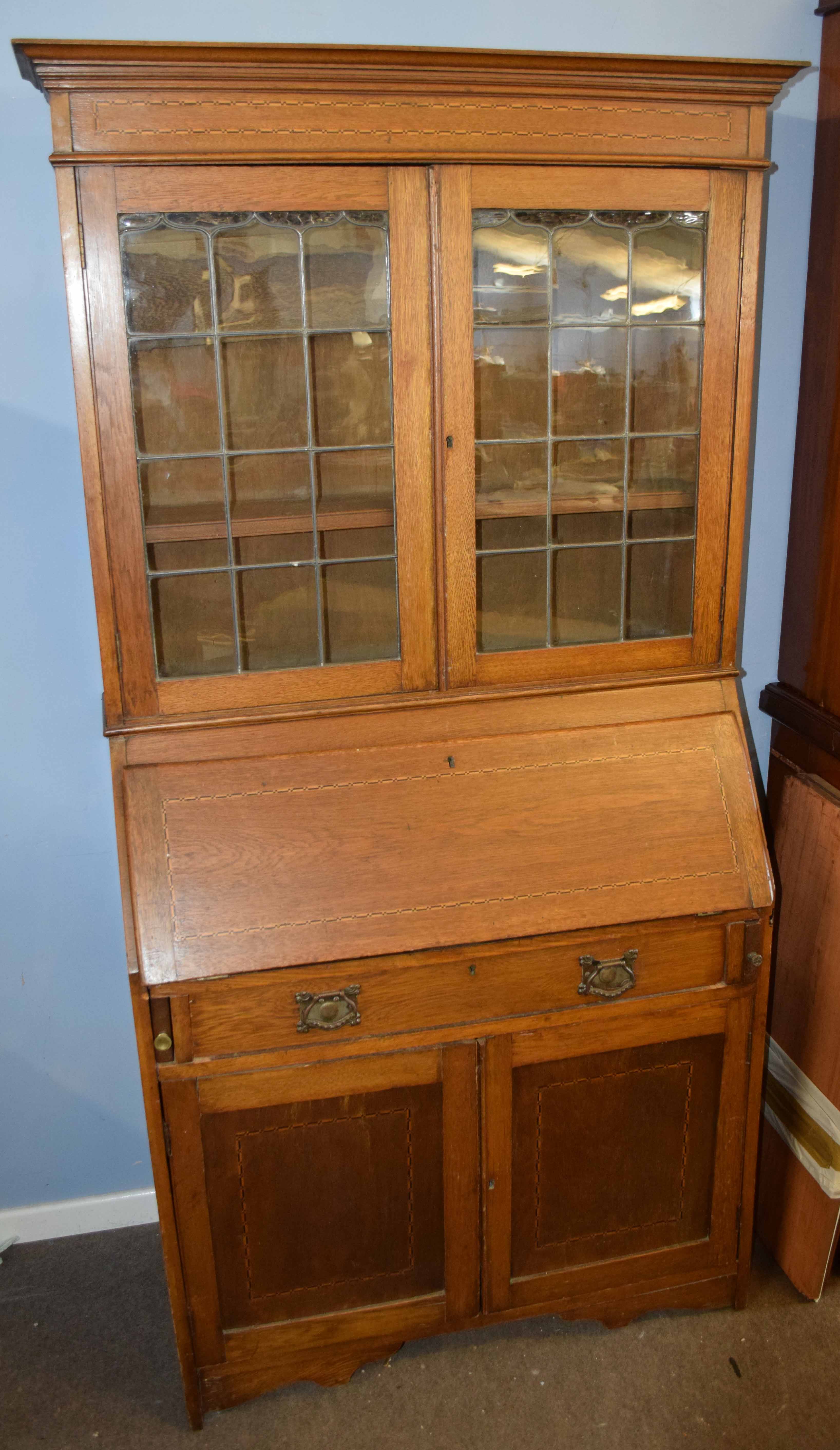 Edwardian bureau bookcase, inlaid with geometric panels and leaded glazed top enclosing fitted