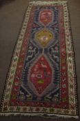 Caucasian large wool runner, double gull border, central panel of three interlinked lozenges with