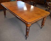 19th century mahogany wind out extending dining table with moulded edge on turned legs extends to