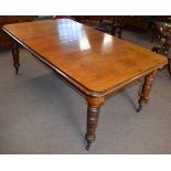 19th century mahogany wind out extending dining table with moulded edge on turned legs extends to