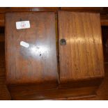 Victorian oak stationery cabinet with sloping doors and closing fitted interior 29cm wide