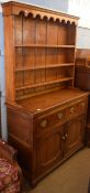 Oak small dresser, plate rack back, lower section with two drawers and cupboard below on bracket