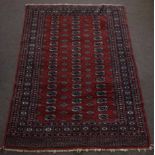 Bokhara style Caucasian wool rug triple gull border, central panel of geometric lozenge mainly