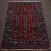 Bokhara style Caucasian wool rug triple gull border, central panel of geometric lozenge mainly