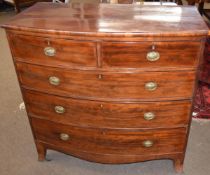 Early 19th century mahogany bow fronted chest of two short and three full width drawers on splay