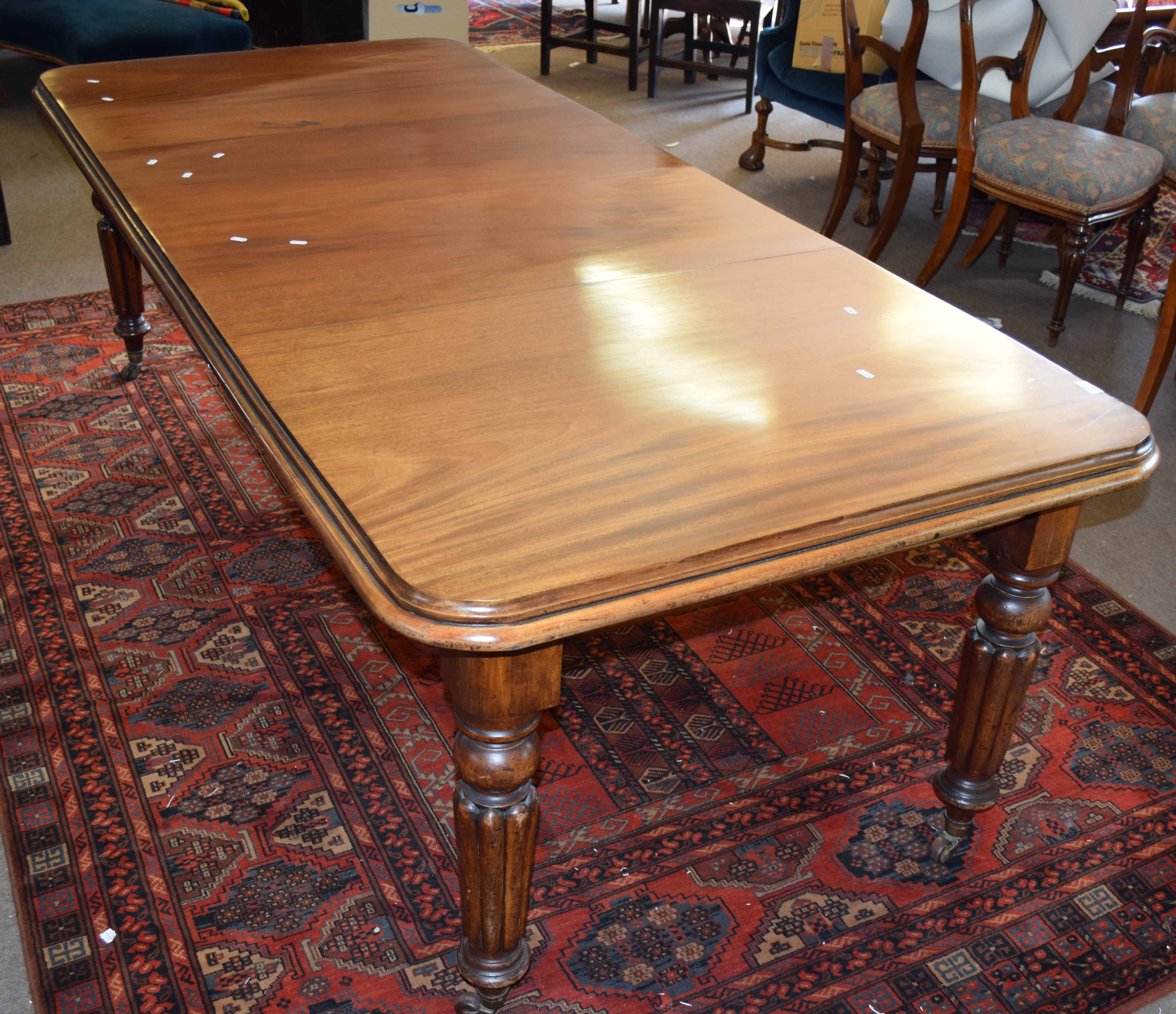 19th century mahogany wind out extending dining table with moulded edge raised on baluster and - Image 2 of 2