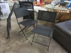 Four folding fabric chairs