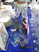 GROUP OF GLASS WARES INCLUDING FOUR CUT GLASS WINE GLASSES WITH COLOURED STEMS