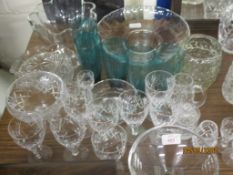 QUANTITY OF CUT GLASS WARES INCLUDING TWO FRUIT BOWLS, GREEN GLASS BEAKERS AND CUT GLASS WINE