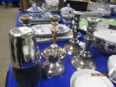 GROUP OF PLATED WARE CANDLESTICKS AND A COCKTAIL SHAKER