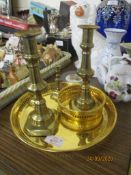 CIRCULAR TRAY CONTAINING TWO SETS OF COPPER CANDLESTICKS AND OTHER ITEMS INCLUDING STAFFORDSHIRE