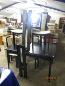 MODERN BLACK LACQUERED EXTENDING DINING TABLE AND FIVE CHAIRS
