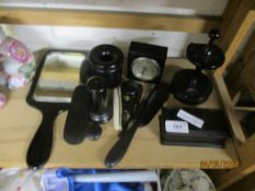 COLLECTION OF MAINLY WOODEN DRESSING TABLE IMPLEMENTS INCLUDING SMALL CLOCK AND A MIRROR