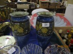 PAIR OF MID-20TH CENTURY ROYAL DOULTON VASES, THE BLUE GROUND WITH A TUBE LINED DESIGN OF LEAVES AND