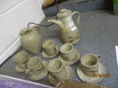 STUDIO POTTERY TYPE COFFEE POT AND SIX CUPS AND SAUCERS WITH A BROWN LEAF DESIGN