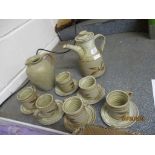 STUDIO POTTERY TYPE COFFEE POT AND SIX CUPS AND SAUCERS WITH A BROWN LEAF DESIGN