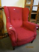 RED UPHOLSTERED WING ARMCHAIR