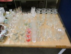 EXTENSIVE QUANTITY OF GLASS WARES INCLUDING WINE GLASSES, VASES, TUMBLERS ETC